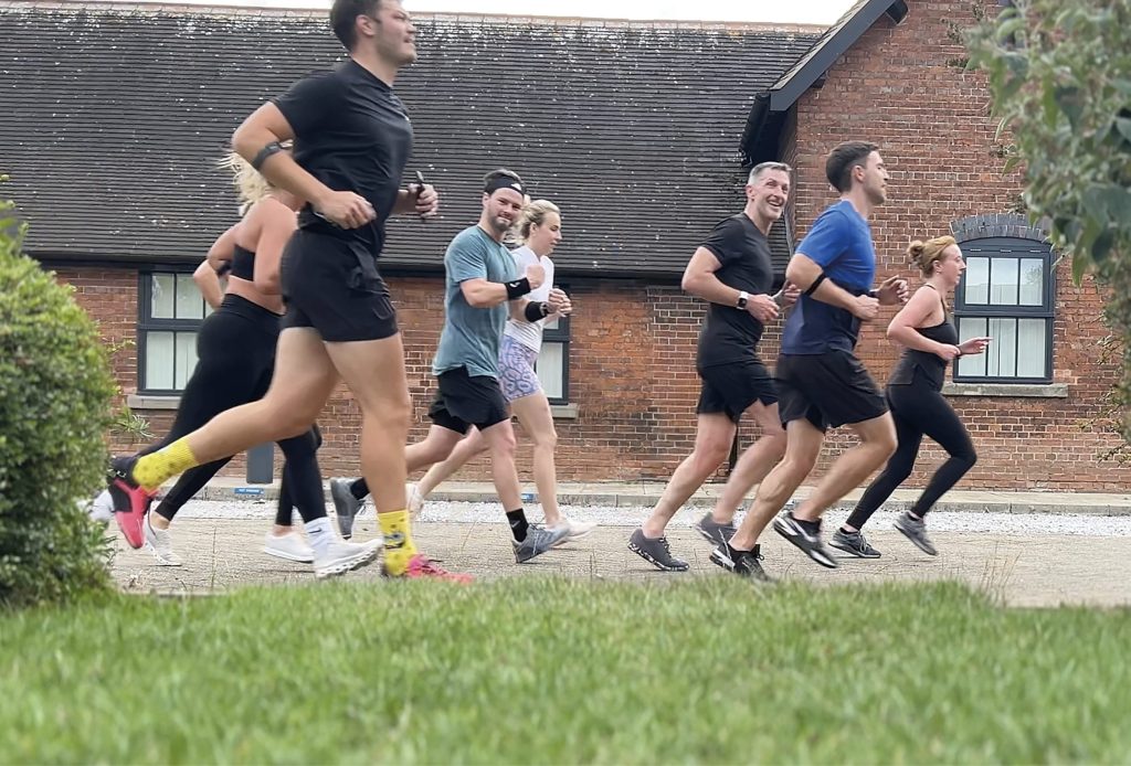 A group of people running outside